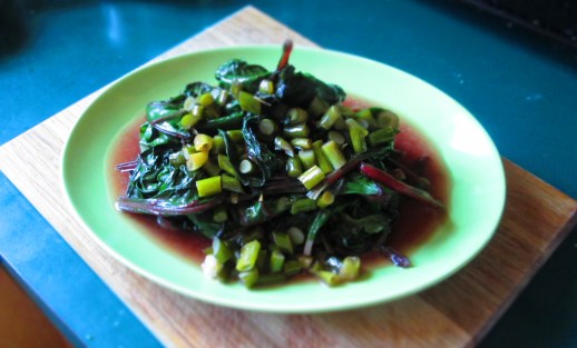 Beet greens with garlic scapes